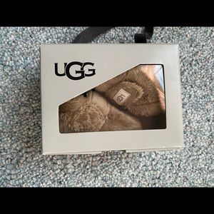 Newborn baby Uggs-like new in box. Worn once.
